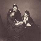 Three girls reading a letter